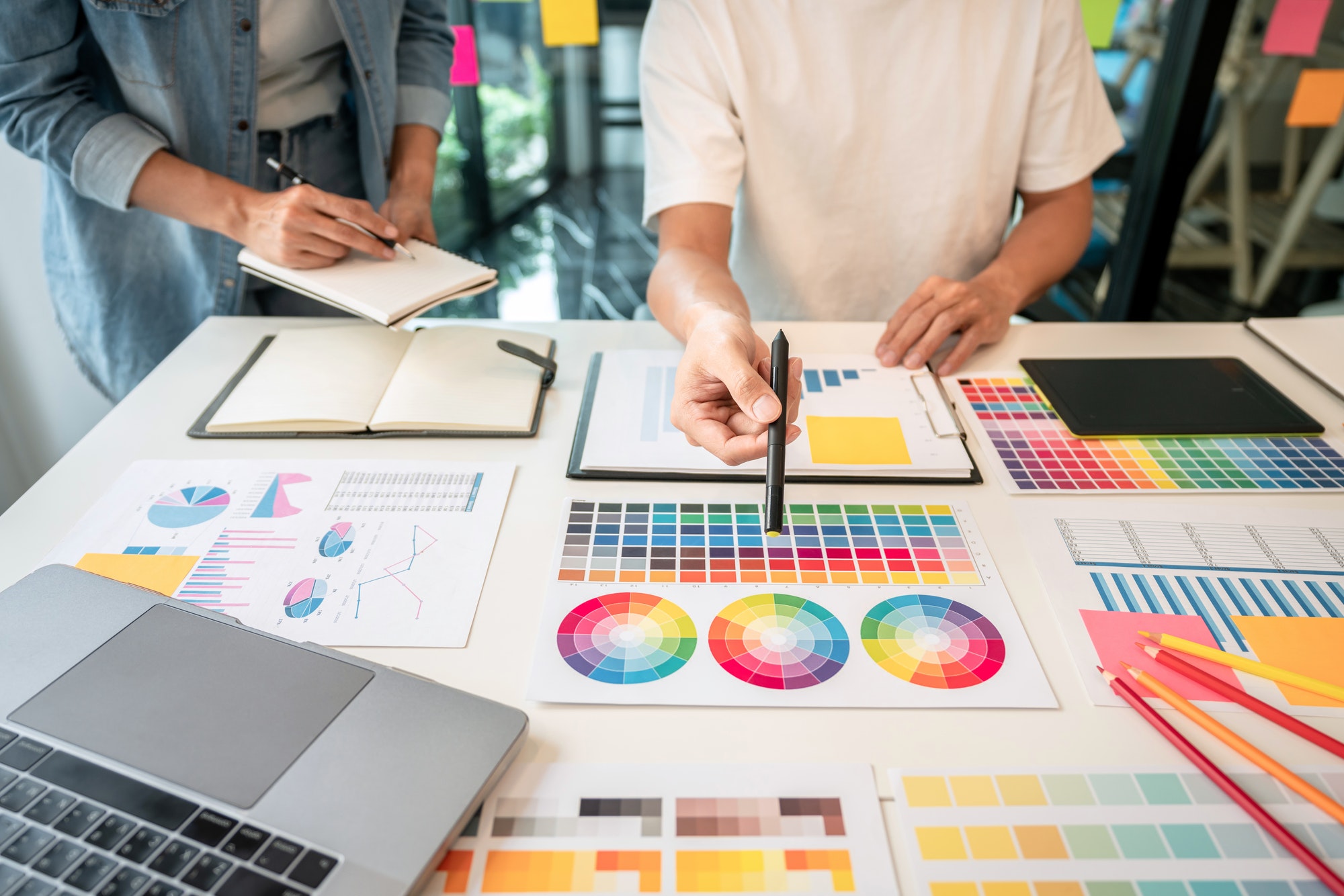 Team of creative graphic designer working on color swatch sample
